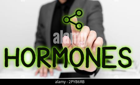 Inspiration zeigt Zeichen-Hormone. Wort über regulatorische Substanzen, die in Organismus transportierten Gewebeflüssigkeiten produziert werden Stockfoto