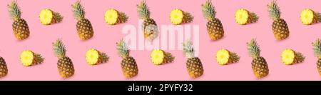 Viele reife Ananas auf rosa Hintergrund. Muster für Design Stockfoto