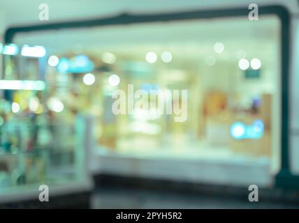 Abstrakt verwackelte Bild von Einkaufszentrum oder Kaufhaus Innenraum Hintergrund Bokeh Licht Stockfoto