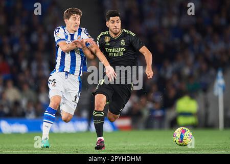 Aihen Munoz von Real Sociedad und Marco Asensio von Real Madrid CF in Aktion während des Spiels La Liga Santander zwischen Real Sociedad und Real Madrid CF Stockfoto