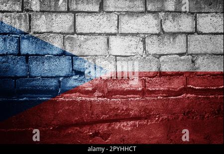 Dunkle Backsteinmauer mit der Flagge Stockfoto