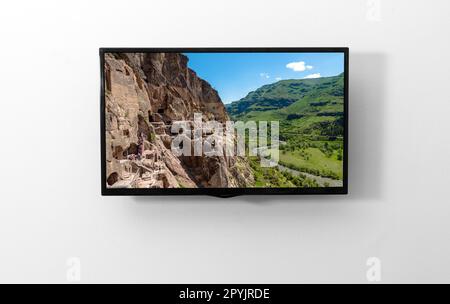 TV-Monitor an der Wand Stockfoto