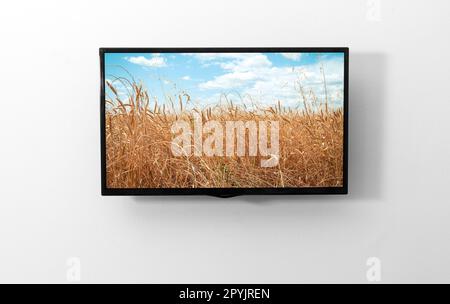 TV-Monitor an der Wand Stockfoto