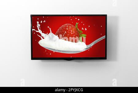 TV-Monitor an der Wand Stockfoto