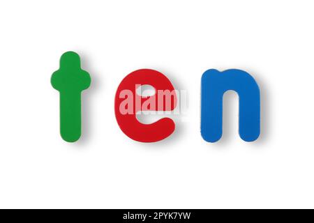 Zehn Wörter in farbigen magnetischen Buchstaben auf weiß mit Beschneidungspfad Stockfoto