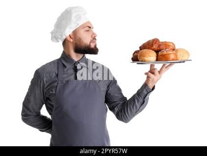 Männlicher Bäcker mit Backblech auf weißem Hintergrund Stockfoto