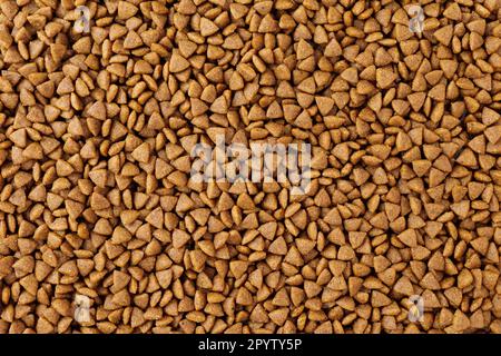 Hintergrund von braunem trockenem Heimtierfutter für Katzen und Hunde Stockfoto