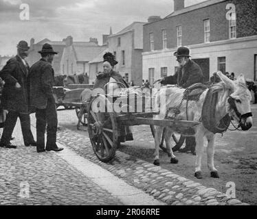 Ein Blick aus dem späten 19. Jahrhundert auf einen Markteier, einen Straßenhändler während des Markttags in Drogheda, County Louth an der Ostküste Irlands. Stockfoto