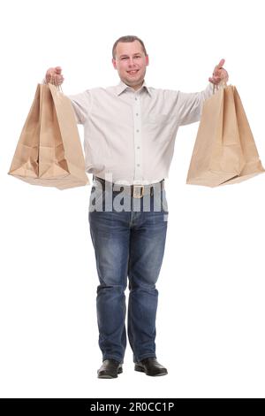 Gut aussehender junger Mann mit Einkaufstaschen Stockfoto