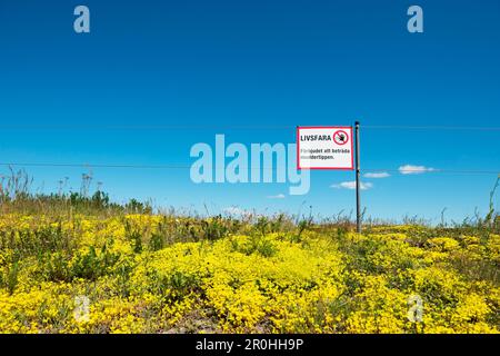 Schwedisches Warnschild für schlammigen Bereich Stockfoto