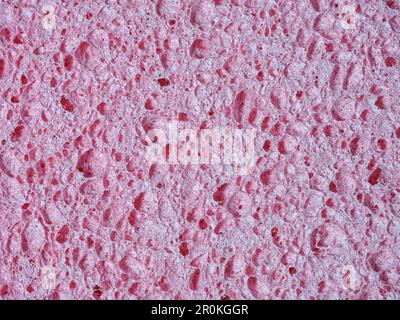 Rosafarbener Waschschwamm, detaillierte Textur des porösen Schwamms Stockfoto