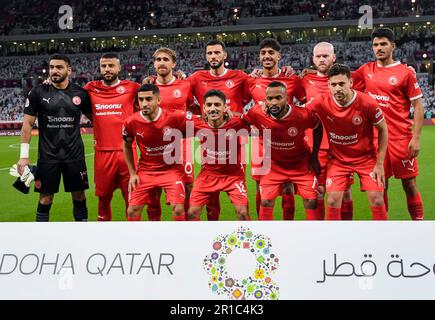 Doha. 12. Mai 2023. Al-Arabi-Sc-Line-up-Spieler posieren für ein Teamfoto vor dem Finale des Amir-Cup-Fußballspiels zwischen Al Sadd SC und Al-Arabi SC im Ahmad bin Ali-Stadion in Doha, Hauptstadt von Katar am 12. Mai 2023. Kredit: Nikku/Xinhua/Alamy Live News Stockfoto