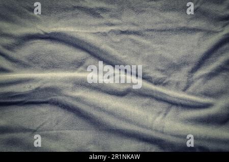 Graue faltigen Stoff Textur. Nahaufnahme von weichen Baumwolltuch werden als Hintergrund verwendet. Stockfoto