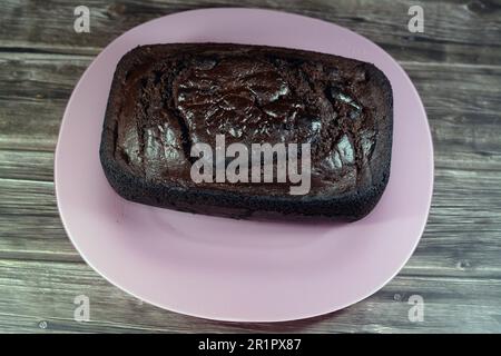 Schokoladenkuchenmischung, köstliche hausgemachte Kuchen, reichhaltige Proteinquelle, Kohlenhydrate, Zucker, Energie, aromatische Leckereien für Gelegenheiten, verpackt in Food-Gra Stockfoto