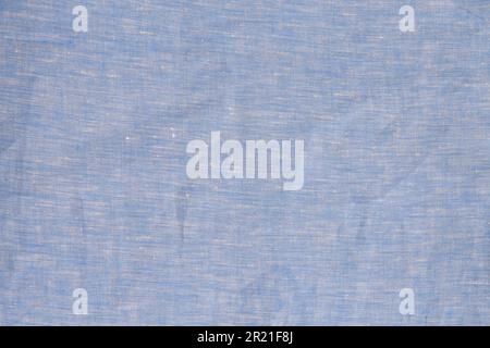 Stoffhintergrund. Blaues Leinengewebe zerknitterte natürliche Baumwolle. Natürlicher handgefertigter Leinenhintergrund mit Draufsicht. Organische umweltfreundliche Textilien. Light Fabric-Linie Stockfoto