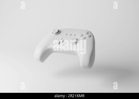 Der weiße Gaming-Controller (Gamepad) schwebt auf weißem Hintergrund und erzeugt Schwarzweißtöne. Konzept der Gaming-, Freizeit- und Unterhaltungsbranche Stockfoto