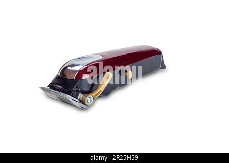 Seitenansicht eines einzelnen roten Haarschneiders für Männer Haarschnitt isoliert auf weißem Hintergrund mit Schneideweg. Stockfoto