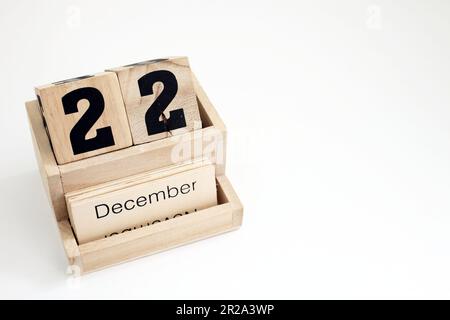 Ewiger Kalender aus Holz mit dem 22. Dezember Stockfoto