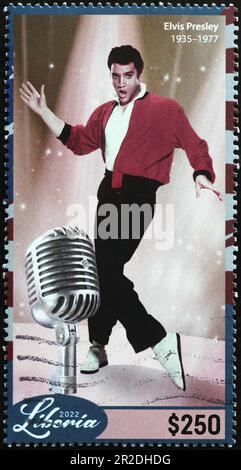 Elvis Presley und Vintage-Mikrofon auf Briefmarken Stockfoto