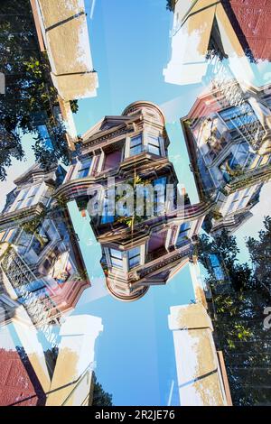 Doppelter Blick auf ein farbenfrohes Holzwohngebäude im viktorianischen Stil in der Hayes Street in San Francisco, Kalifornien. Stockfoto