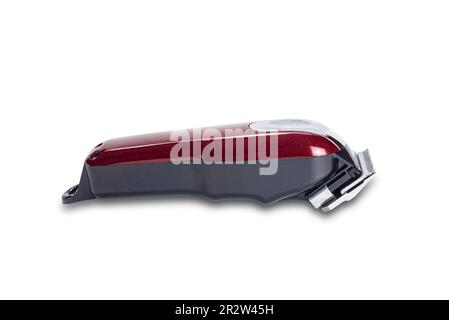 Nahaufnahme einer einzelnen roten Haarschneider-Ausrüstung für Männer Haarschnitt isoliert auf weißem Hintergrund mit Schneideweg. Stockfoto