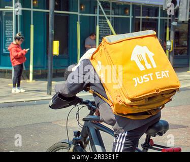 just eat delivery cyclist on the street Stock Photo