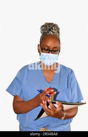 Eine Krankenschwester, gekleidet in ihren Krankenhauspflegern. Stockfoto