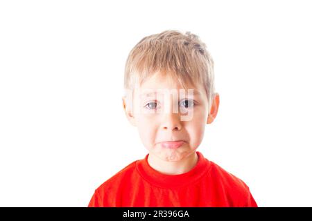 Nahaufnahme des Porträts, das den kleinen Jungen bettelt Stockfoto