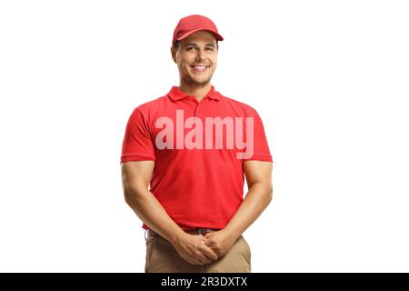 Lächelnder Mann in einem roten T-Shirt und einer roten Kappe isoliert auf weißem Hintergrund Stockfoto