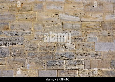 Hintergrund einer alten Mauer aus Naturstein Stockfoto