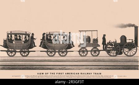 Blick auf den ersten amerikanischen Eisenbahnzug mit männlichen Fahrgästen, die in Reisebussen auf der Eisenbahn fahren. Stockfoto