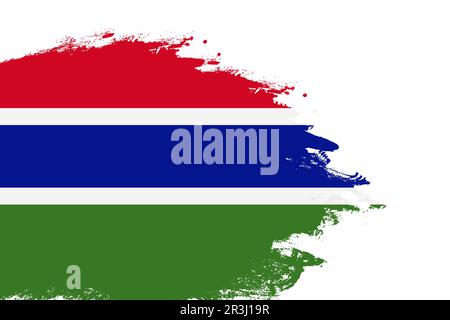 Gambia-Flagge auf einem gefärbten Strichpinsel, isolierter weißer Hintergrund mit Kopierbereich Stockfoto