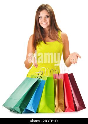Glückliche Mädchen mit bunten Papier-Einkaufstüten isoliert auf weiss Stockfoto