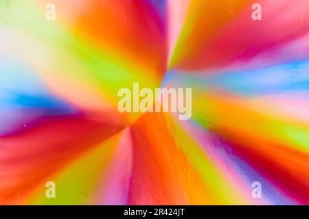 Abstract rainbow from sugar in skittles mixed with water making candy colors pop on background asset Stockfoto
