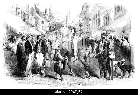 Eine Straße in Konstantinopel, 1856. Krimkrieg, Türkei: "...das europäische Element überwiegt in größerem Maße. Der Dandy Amateur mit Jim Crow Hut, umgeben von einem Schleier, ist Arm in Arm mit dem Dandy britischen Offizier, Wer mit seinen langen Sporen auf dem schlechten Bürgersteig zuckt... Er hat gelernt, sich nicht über die Nähe von Hunden ärgern zu lassen - in der Türkei sind sie dreckige Bösewichte - und mit großer Gelassenheit die Bitte dreckiger kleiner, malerischer Jungs zu behandeln, unzählige Dinge zu tun, die wir nicht verstehen können... unter ihren Markisen, in der Zwischenzeit sitzen einige Türken - hier, wie überall und in allen Situationen - faul und besetzt; w Stockfoto