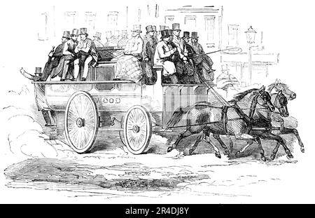 Der Manchester Drei-Pferde-Omnibus, 1856. Öffentliche Verkehrsmittel in den Provinzen. „Unter [den Arten der öffentlichen Unterkünfte]... gibt es mehrere Variationen: Die, die wir eingraviert haben, transportiert siebzehn Passagiere drinnen und fünfundzwanzig draußen - zwei auf jeder Seite der Fahrer, fünf auf dem Sitz dahinter und acht auf jedem Seitensitz. Der erhöhte Teil im Dach dient als Rückenlehne zu den Sitzen an den Seiten und bietet Platz im Inneren für einen gut großen Mann, der die Mitte des Omnibus hinaufgeht. Es gibt keine Tür; der Leiter kommuniziert mit dem Fahrer über eine Glocke unter dem Sitz des Fahrers. Das dri Stockfoto