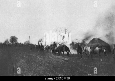 "La tragique retraite Serbe; La derniere colonne de la 3c armee serbe abandonne le Village de Rajagne", 1915 (1924). Aus „L'Album de la Guerre 1914-1919, Volume I“ [L'Illustration, Paris, 1924]. Stockfoto