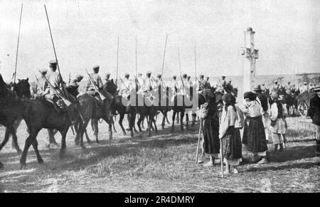 "Les Revers Russes; une Scene de la retraite de nos allies sur le Bug: Des paysannes galiciennes regardent passer une sotnia de cosaques en tenue d'ete, se repliant en bon ordre", 1915. Von „L'Album de la Guerre 1914-1919: Band I“ [L'Illustration, Paris, 1926]. Stockfoto