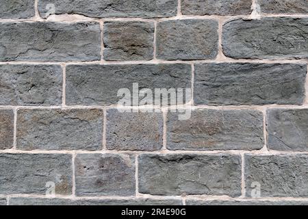 Nahaufnahme einer Natursteinmauer. Stockfoto