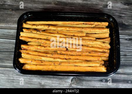 Brotstangen, auch bekannt als Grissini, grissino oder Dipping Stäbchen, Batchverkauf, französische Stangen, gesalzen mit Kreuzkümmel und Anis, in der Regel in Bleistiftgröße sti Stockfoto