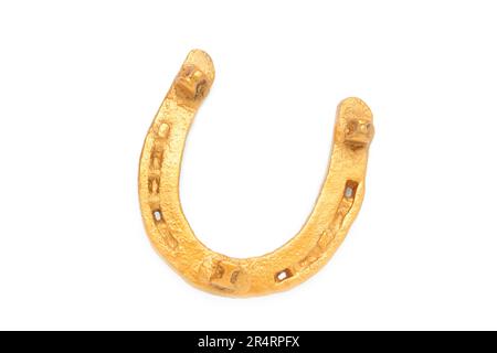 Goldenes Hufeisen isoliert auf weißem Hintergrund. Draufsicht Stockfoto