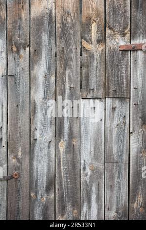 Nahaufnahme einer alten Holztür, eines Hintergrunds oder einer Tapete. Stockfoto