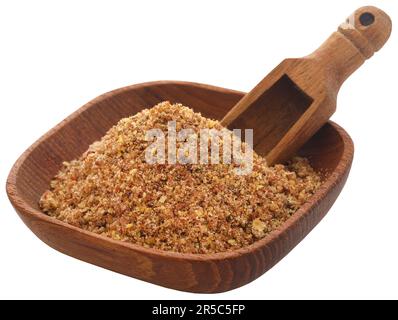 Zerstoßene Flachskörner in einer Schüssel mit Schaufel Stockfoto