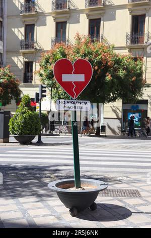 No violencia machista traffic sign seen in a shopping street in Spain against transgressive behaviour Stock Photo