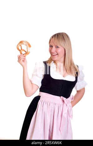 Frau in traditionell traditionell traditionell traditionell traditionell Traditionelles traditionelles traditionelles Kostüm mit Brezel Stockfoto