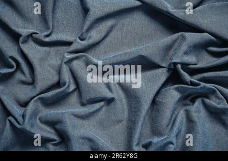 Blauen faltigen Stoff Textur. Nahaufnahme von weichen Baumwolltuch werden als Hintergrund verwendet. Stockfoto