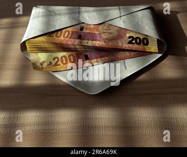 Ein Stapel rand-Banknoten in einem Umschlag auf einer Holzfläche unter stimmungsvoller Beleuchtung - 3D-Darstellung Stockfoto