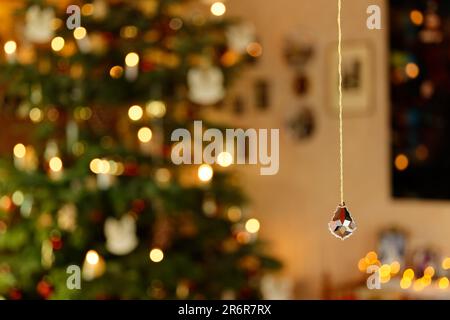Cut and Faved Crystal in Front of Christmas Background Concept Stockfoto