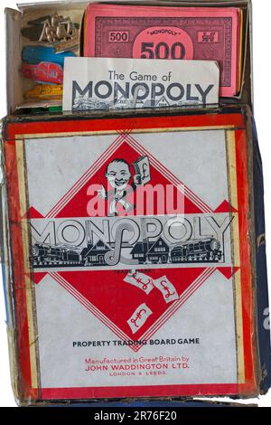 Vintage Monopoly Property Trading Board Game Trade Mark 711981 von John Waddington Ltd - Box geöffnet mit Anweisungen und Vintage Monopoly Geld Stockfoto