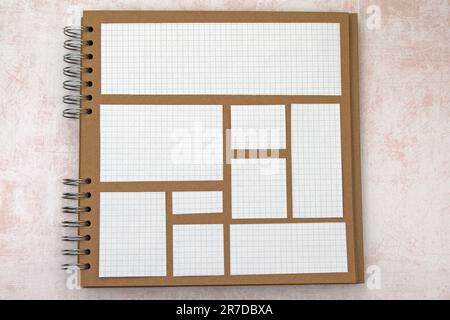 Quadratisch gefütterte Papierausschnitte auf Schrottbüchern mit Ringbindung. Verschiedene Größen. Speicherplatz kopieren Stockfoto